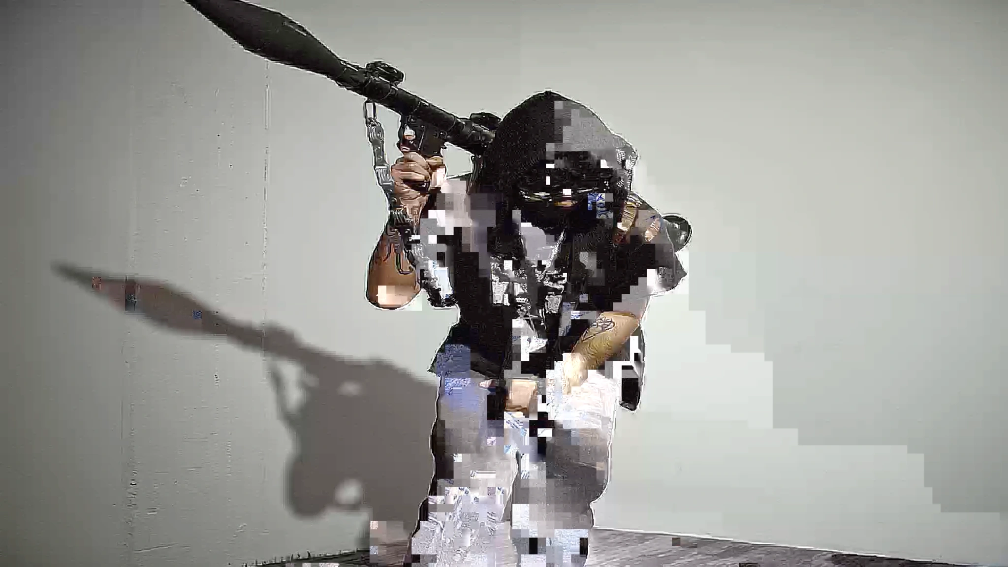 A masked figure breaking into digital fragments